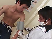 In the medical exam room, the kinky doctor begins assessing his skinny Asian patient