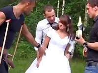 Russian bride enjoys an interracial gang-bang outdoors
